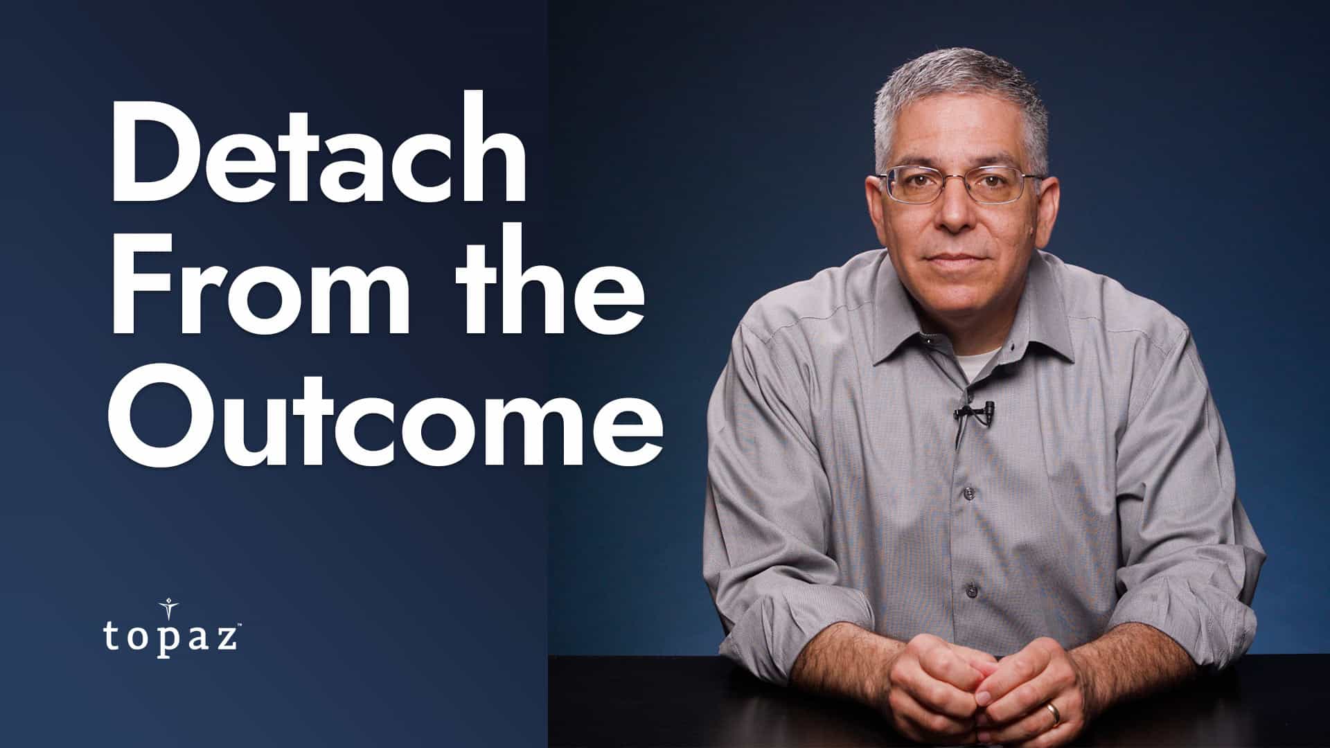 Jorge Chavez at a Desk with Headline: Detach Yourself from the Outcome